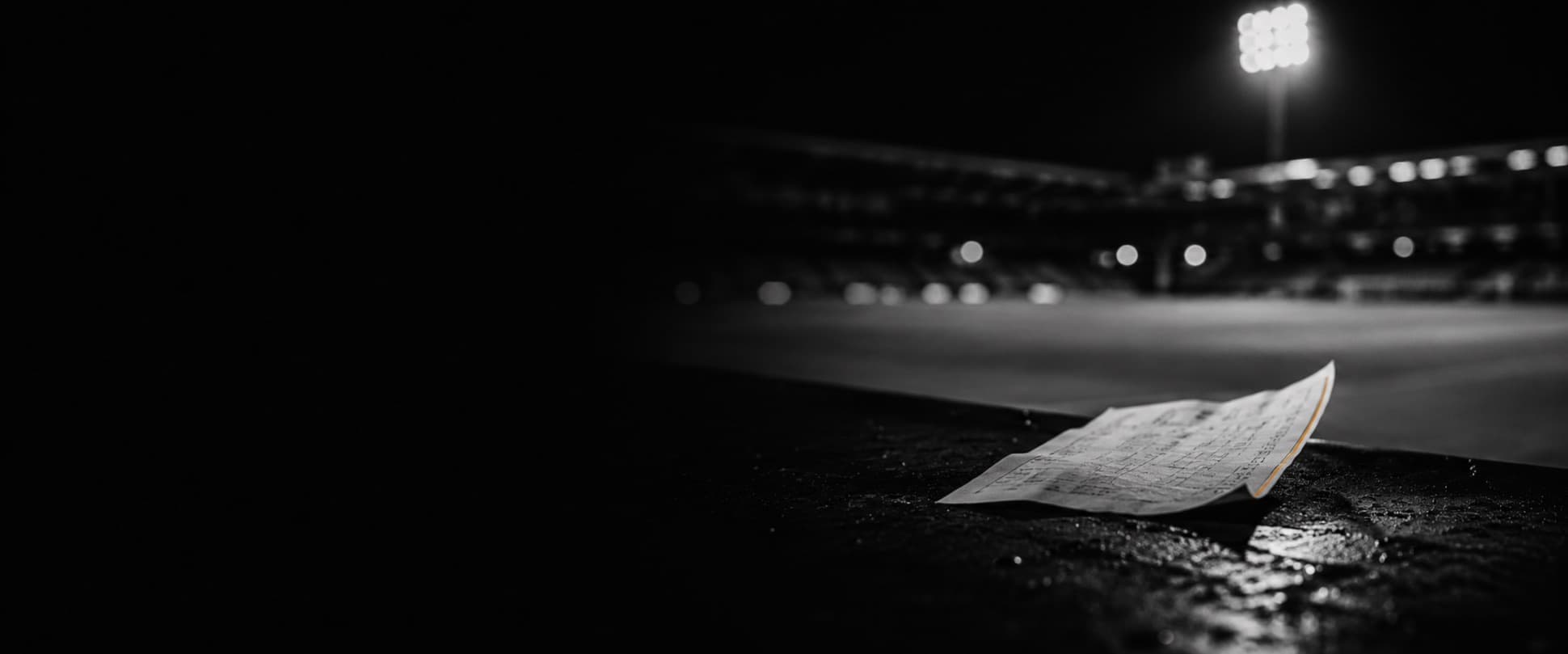Thermal settlement receipt on a dark surface after the match